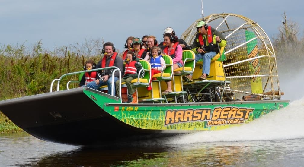 Family enjoying a ride on the Marsh Beast airboat through Florida wetlands